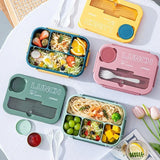 Student and office worker-friendly compartmentalized lunch box with fork and spoon, suitable for microwave use