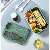 Student and office worker-friendly compartmentalized lunch box with fork and spoon, suitable for microwave use