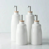 Ceramic Oil Bottle Pot Soy Sauce Vinegar Leakproof Bottle Condiment Jar Creative Metal spout spice bottle‌ condiment dispenser