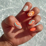 Short Oval Press on Nails Summer Fake Nails Orange Nails Press ons with Wave Flower Design Acrylic Artificial Glue on Nails